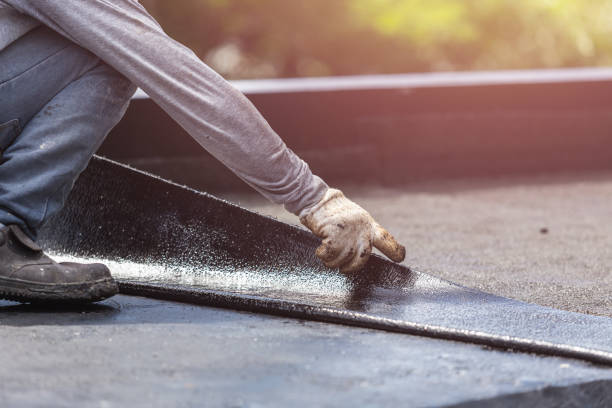 Professional Basement Waterproofing technician working in Feesburg, OH